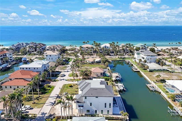 birds eye view of property featuring a water view and a residential view