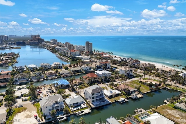 drone / aerial view with a view of city and a water view