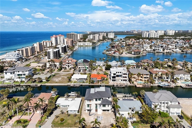 bird's eye view featuring a water view and a city view