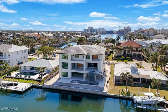 bird's eye view featuring a view of city and a water view