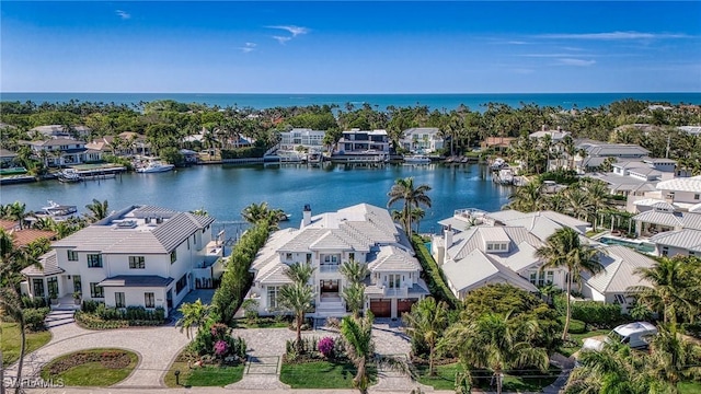 aerial view with a water view and a residential view