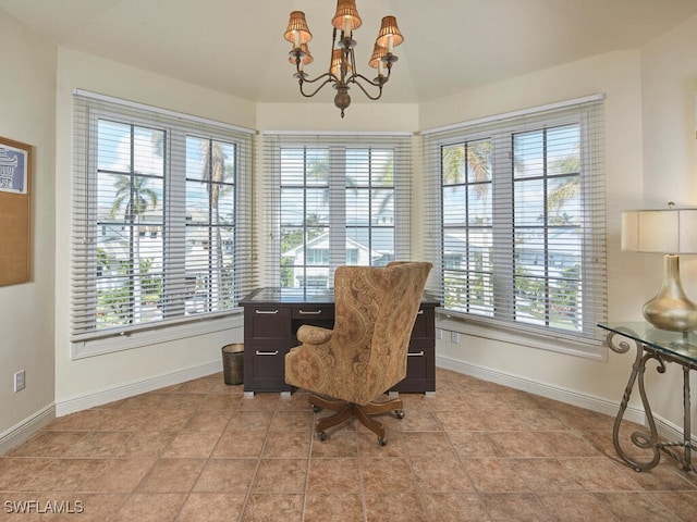 home office with a notable chandelier, light tile patterned floors, and a healthy amount of sunlight