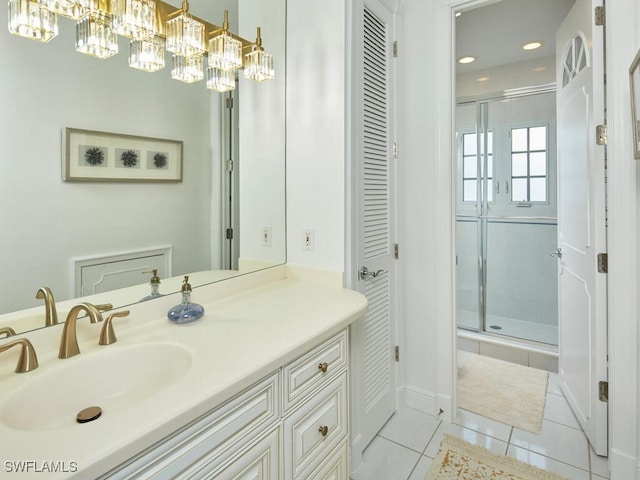 bathroom featuring vanity, an enclosed shower, and tile patterned floors