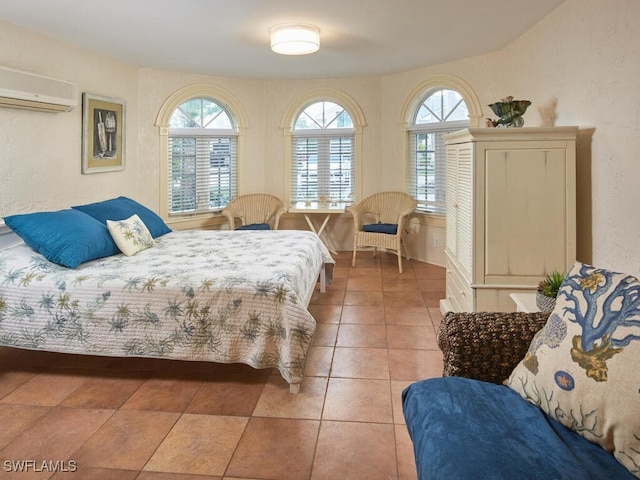 tiled bedroom with a wall mounted air conditioner