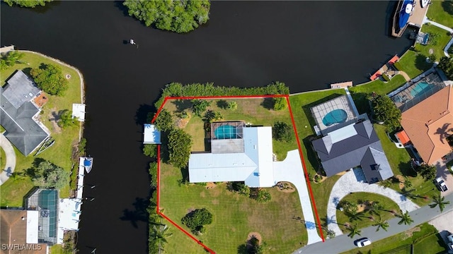 birds eye view of property featuring a water view