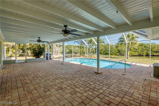 view of pool featuring a lanai, a patio area, and ceiling fan