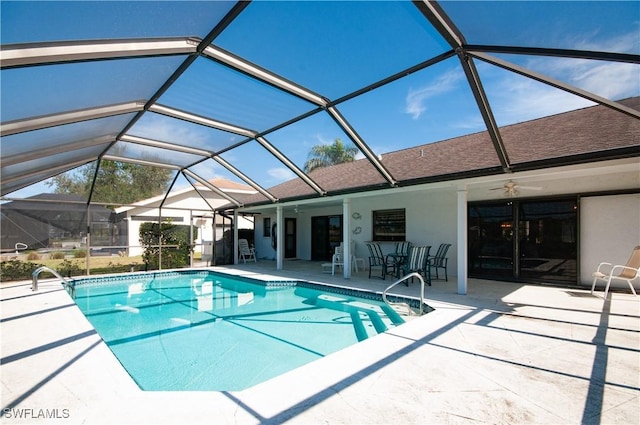 view of swimming pool featuring a bar, a lanai, and a patio area