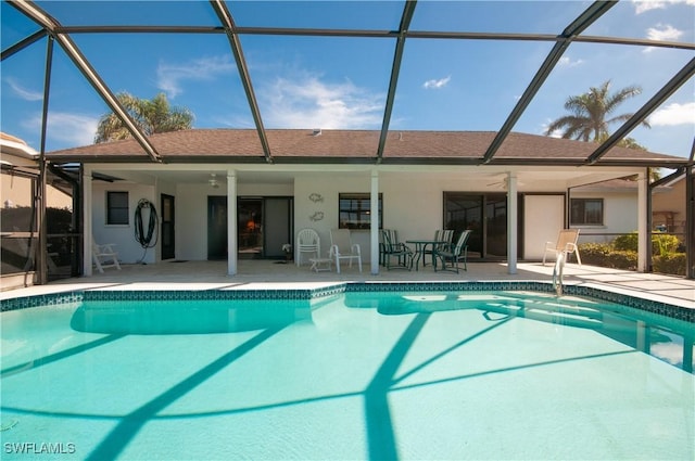 view of pool featuring a lanai, a patio area, and ceiling fan