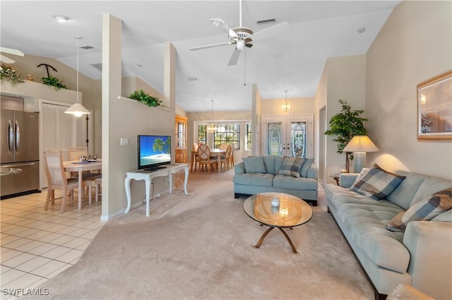 living room featuring high vaulted ceiling, light colored carpet, french doors, and ceiling fan