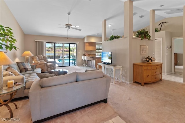 living room with light carpet, lofted ceiling, and ceiling fan