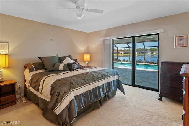 carpeted bedroom with a water view, ceiling fan, and access to outside