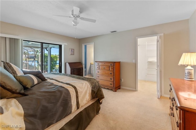 bedroom featuring light carpet, access to exterior, and ceiling fan