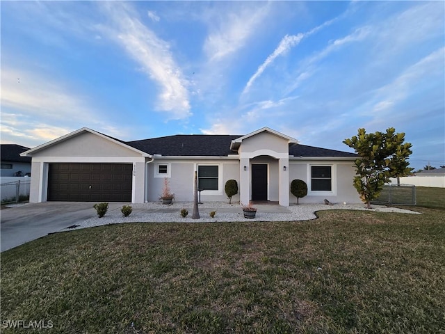 ranch-style house with a garage and a front yard