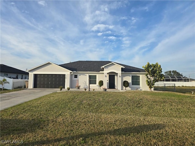 ranch-style home with a garage and a front yard