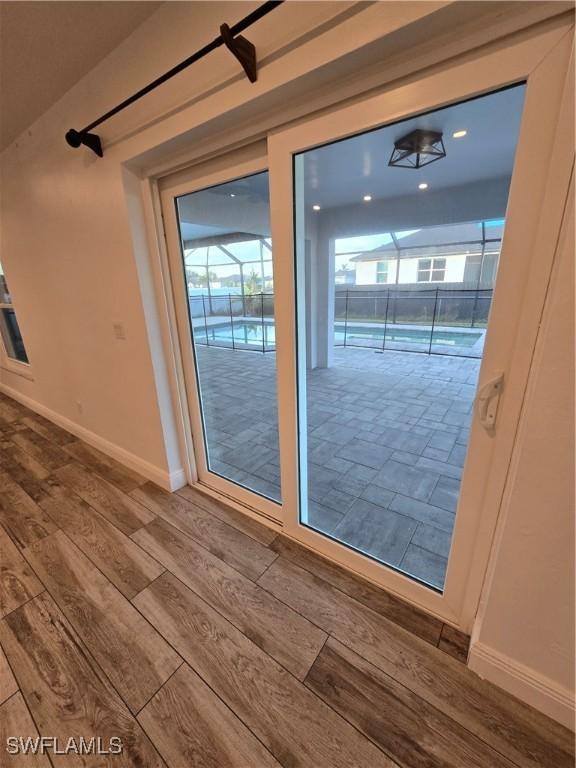 doorway to outside featuring hardwood / wood-style floors