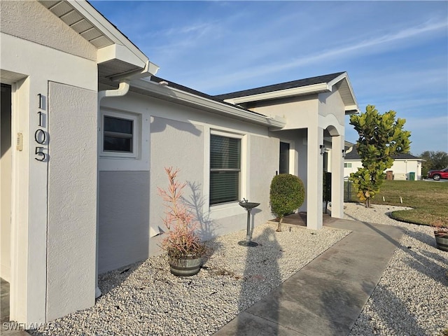 view of property exterior with a patio