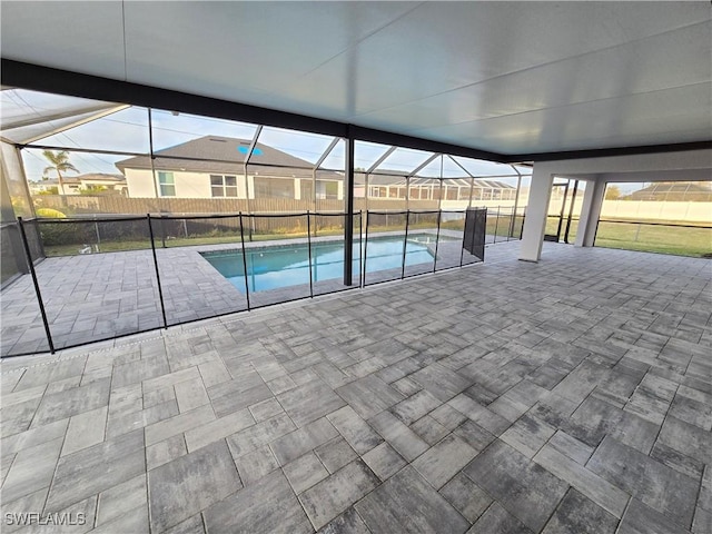 view of swimming pool with a patio and a lanai