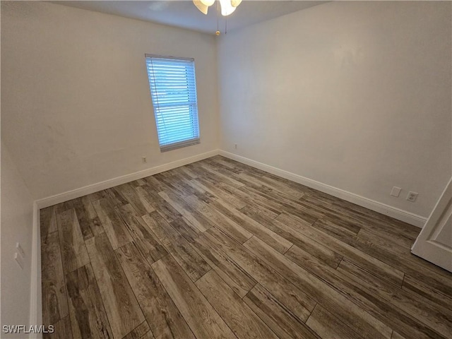 empty room with ceiling fan and hardwood / wood-style floors