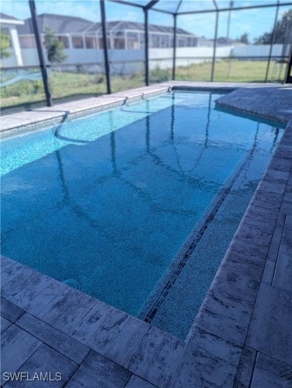 view of pool featuring a lanai