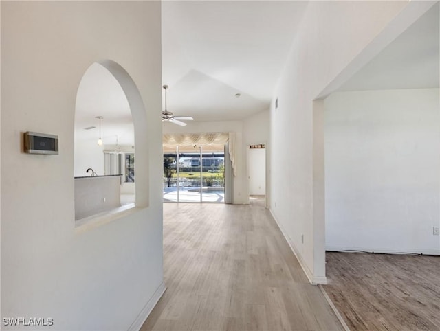 hall with light wood-type flooring