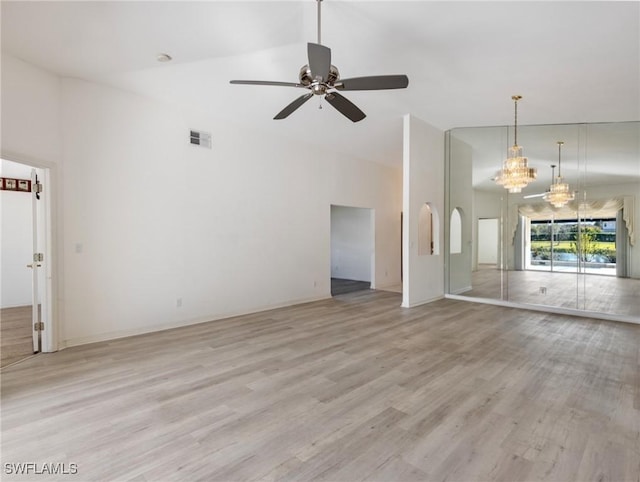 unfurnished living room with ceiling fan, high vaulted ceiling, and light hardwood / wood-style floors