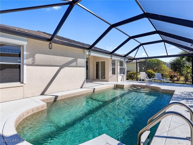 view of pool featuring a lanai and a patio