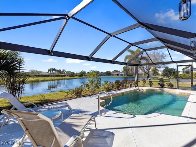 view of swimming pool with a patio, a water view, and glass enclosure