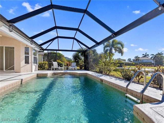 view of pool featuring a patio and glass enclosure