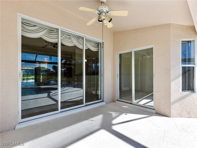 view of patio featuring ceiling fan