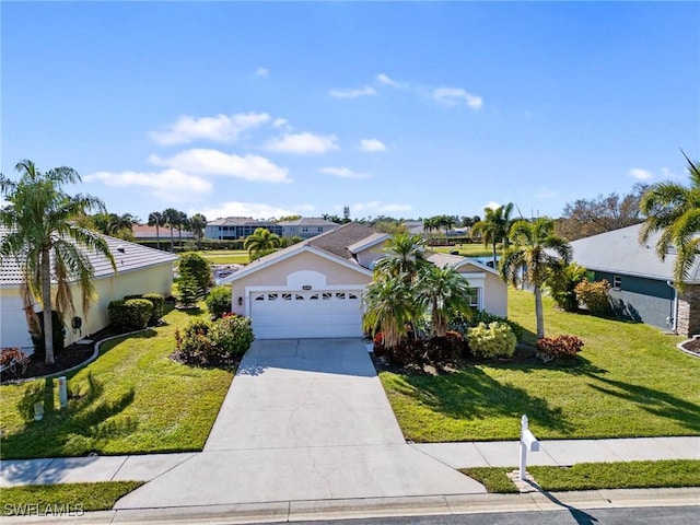 view of front of home featuring a garage and a front lawn