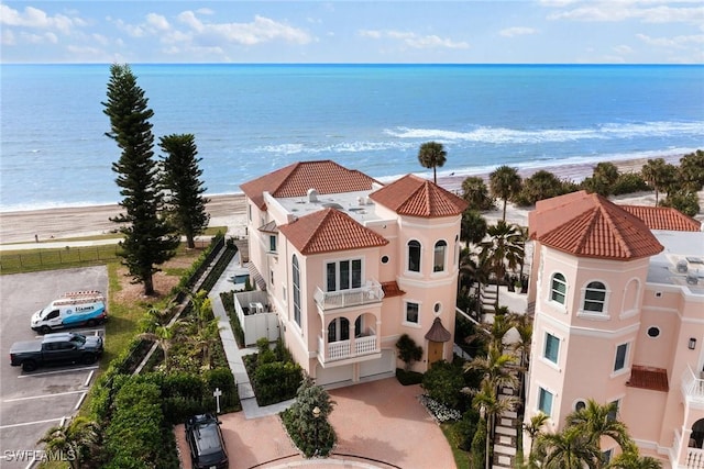 bird's eye view featuring a water view and a view of the beach