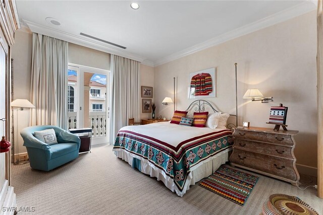 bedroom featuring ornamental molding, carpet, and access to outside