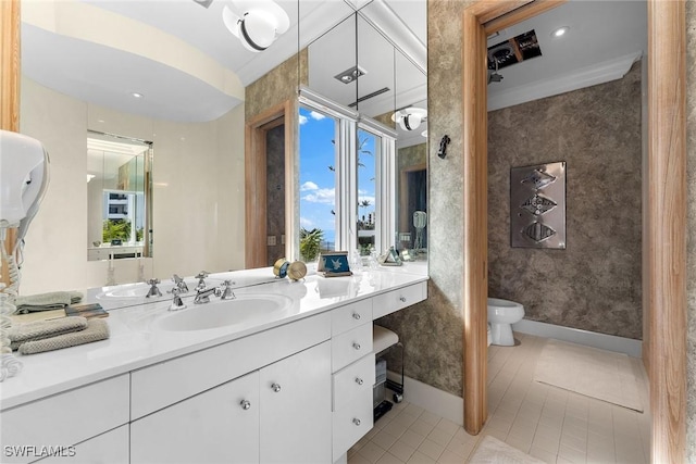 bathroom with vanity, tile patterned floors, and toilet