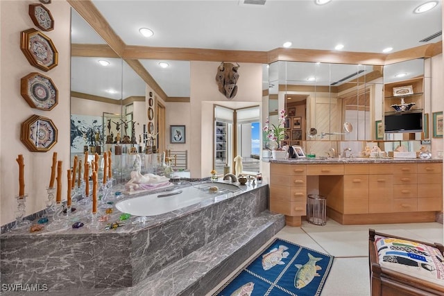 bathroom featuring a relaxing tiled tub, tile patterned floors, and vanity