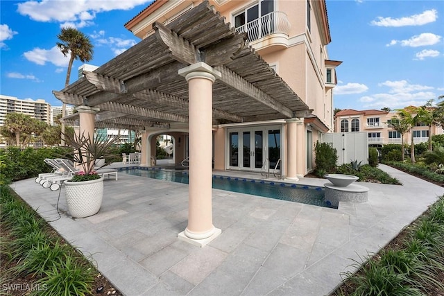 view of swimming pool featuring a pergola and a patio