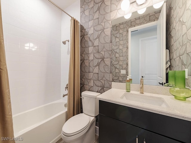 full bathroom featuring shower / bath combo, vanity, and toilet