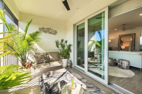 balcony with ceiling fan and a patio area