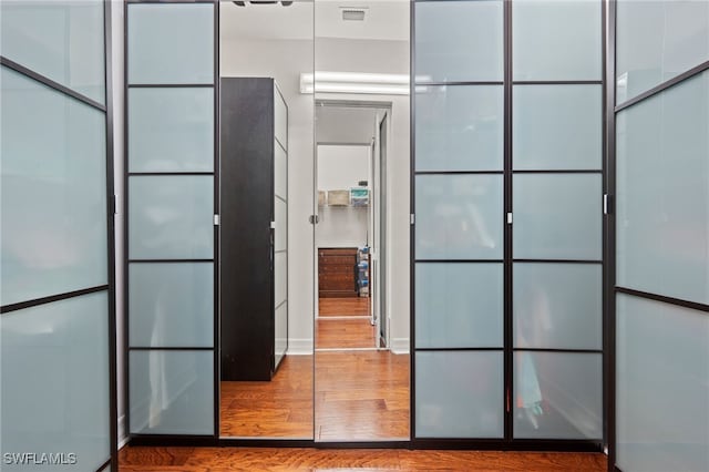 interior space with hardwood / wood-style flooring and a package area