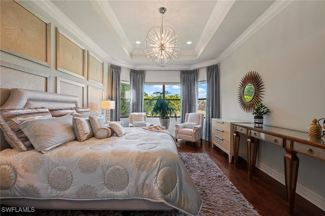 bedroom with an inviting chandelier, ornamental molding, dark hardwood / wood-style floors, and a raised ceiling