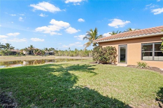 view of yard with a water view