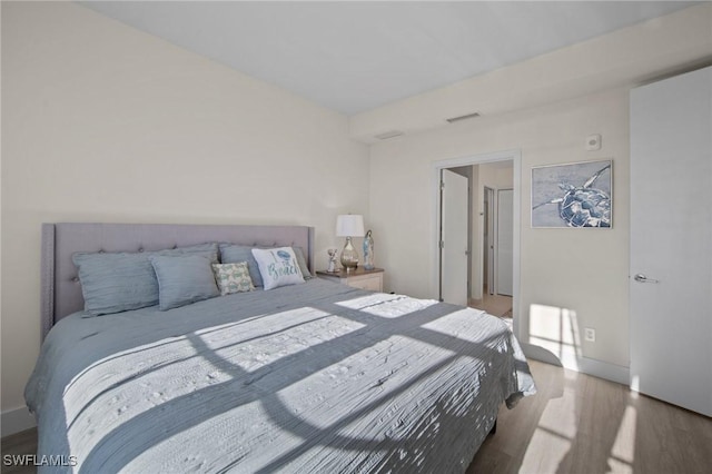 bedroom featuring light wood-type flooring