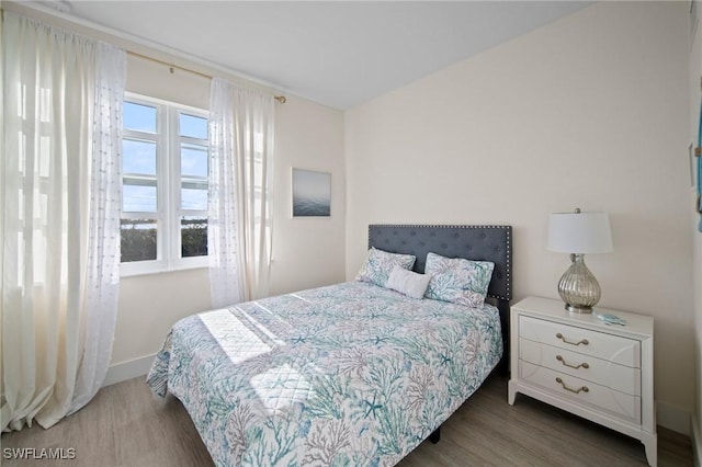 bedroom featuring dark hardwood / wood-style floors