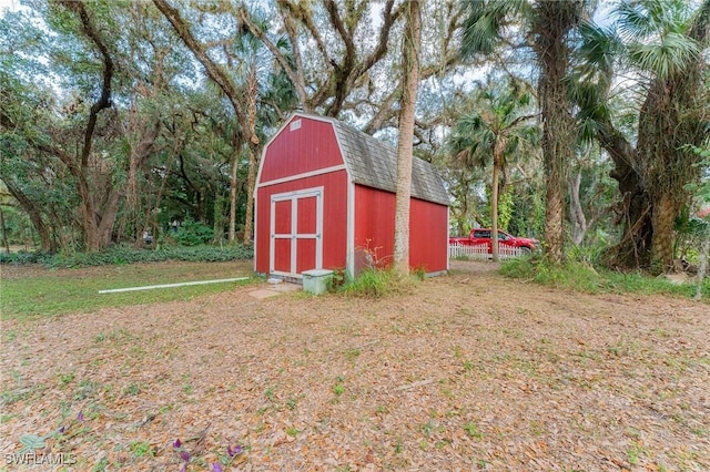 view of outbuilding with a lawn