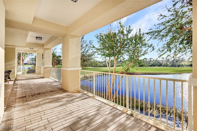 wooden terrace with a water view