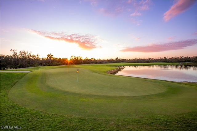 surrounding community with a water view