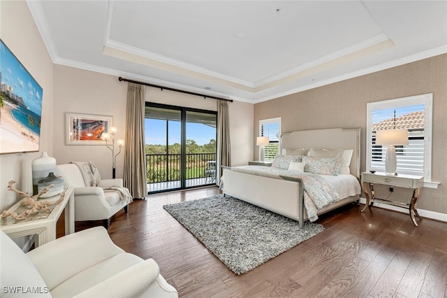 bedroom featuring a tray ceiling, dark wood-type flooring, access to outside, and crown molding