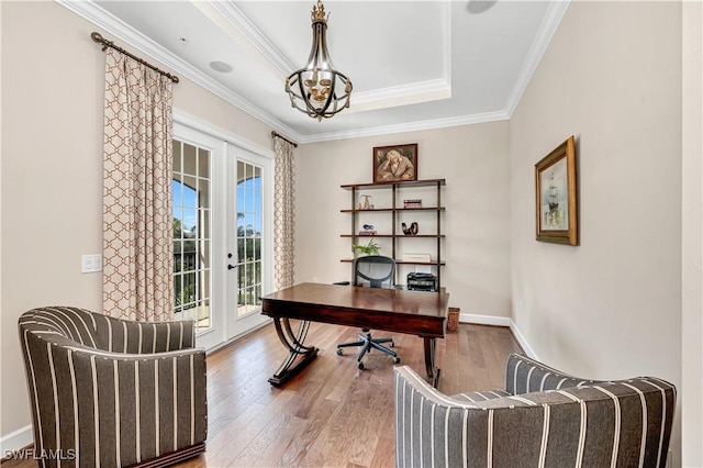 office area with a notable chandelier, wood-type flooring, ornamental molding, and french doors