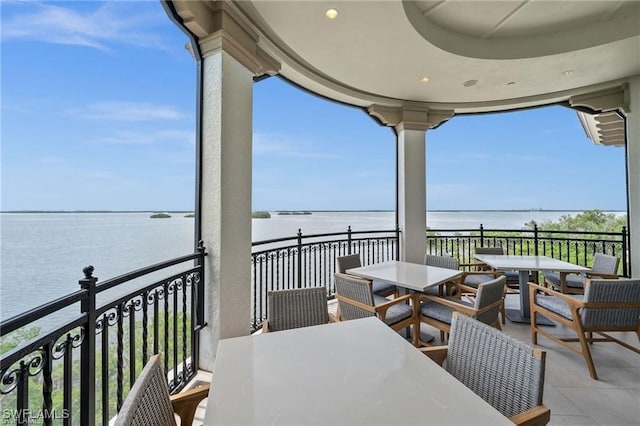 balcony featuring a water view