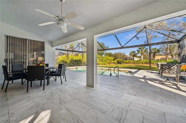 view of patio / terrace with glass enclosure, an outdoor pool, and a ceiling fan