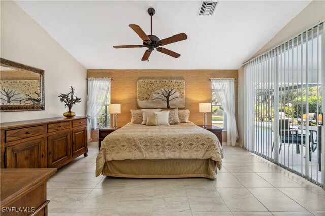 bedroom featuring access to exterior, visible vents, vaulted ceiling, and ceiling fan